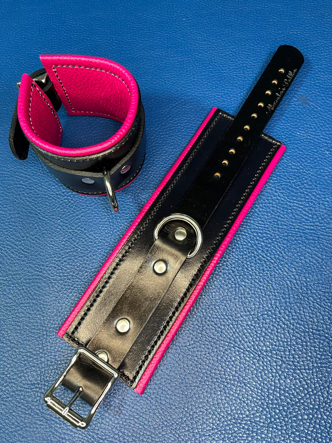 Cuffs: Wrist Cuffs in Pink and Black Leather, one pair